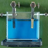 The copper from the aqueous solution of the copper sulfate (CuSO4) precipitates on the cathode The copper from the aqueous solution of the copper sulfate (CuSO4) precipitates on the cathode