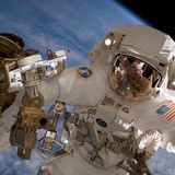 An astronaut assembling the International Space Station