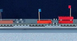 Különböző tömegű kocsik szétlökése rugó segítségével