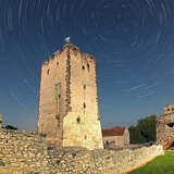 Star trails over a castle