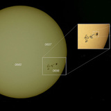 The solar surface speckled with sunspots