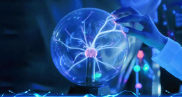 Who discovered that electrons are negatively charged?